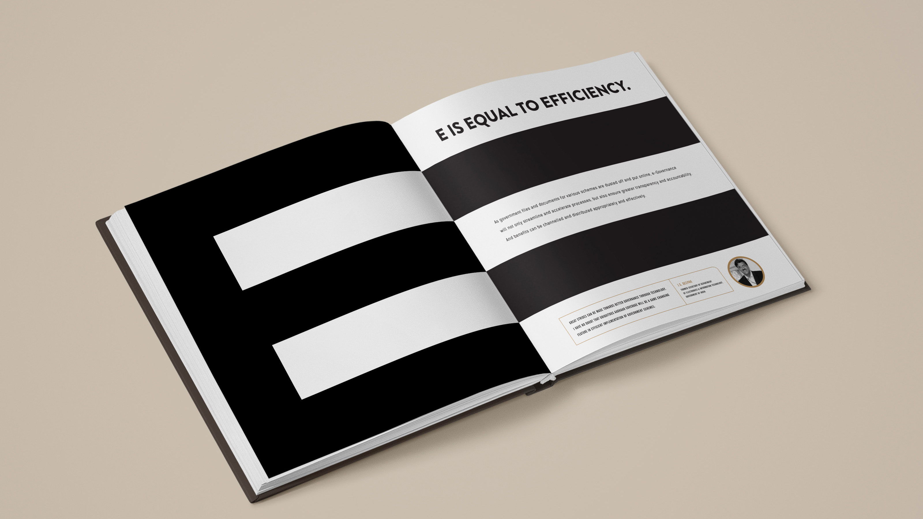 The book open on a spread with a large black equals sign: 'E is equal to efficiency'
