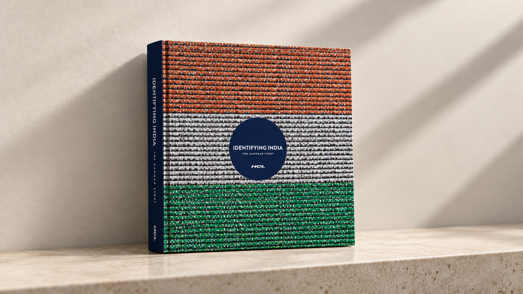 The book standing on a shelf, its cover forming the Indian flag
