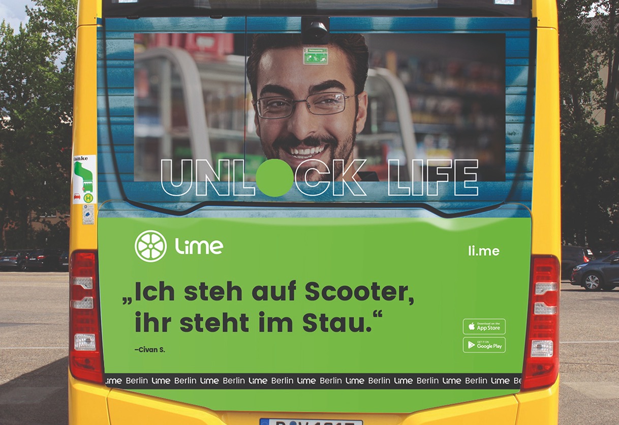 Unlock Life poster displayed on the back of a bus in Berlin