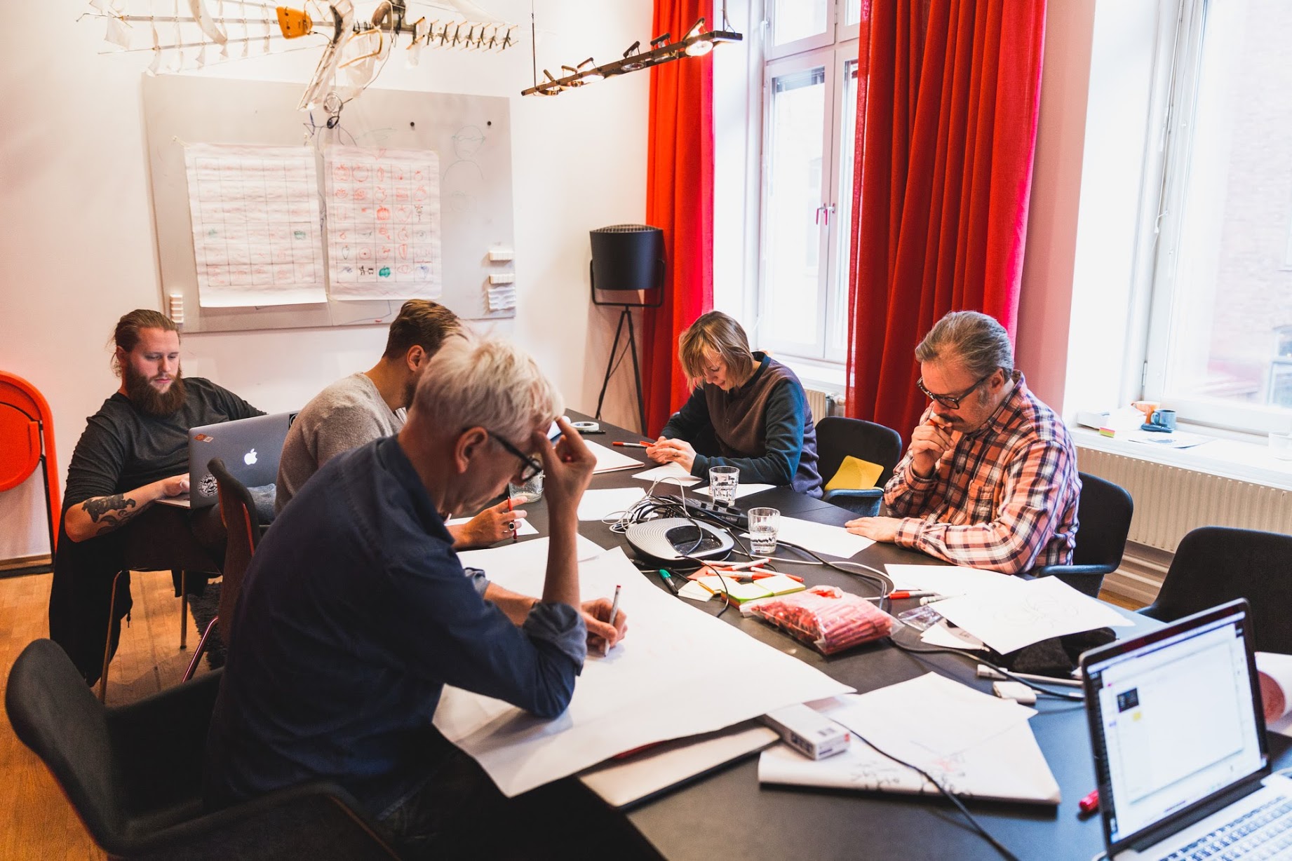 Propellerhead team members working around a table